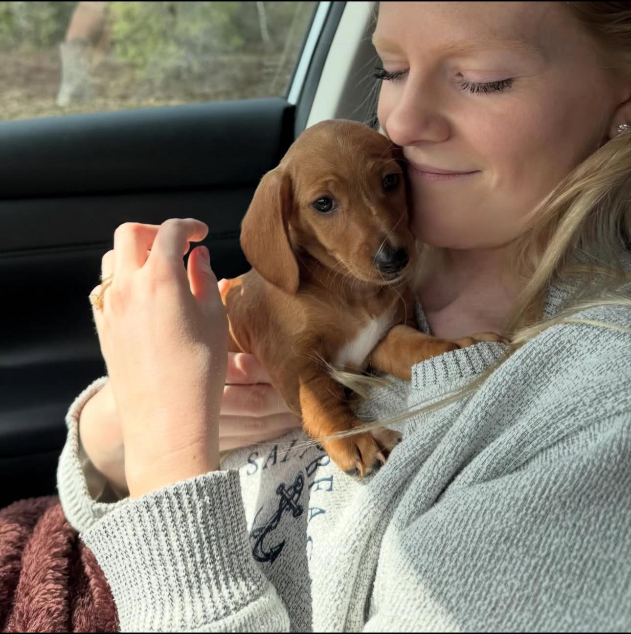 Happy family with their puppy