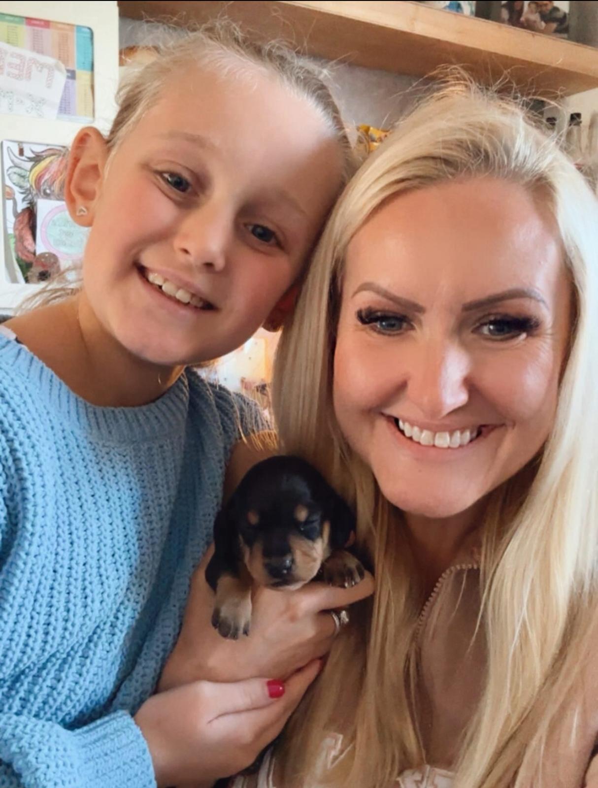 Happy family with their puppy